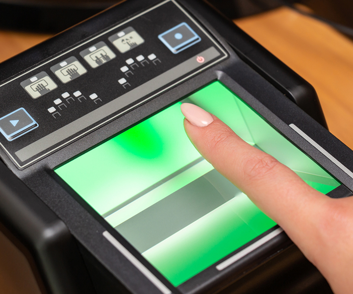 picture of a person getting fingerprinted